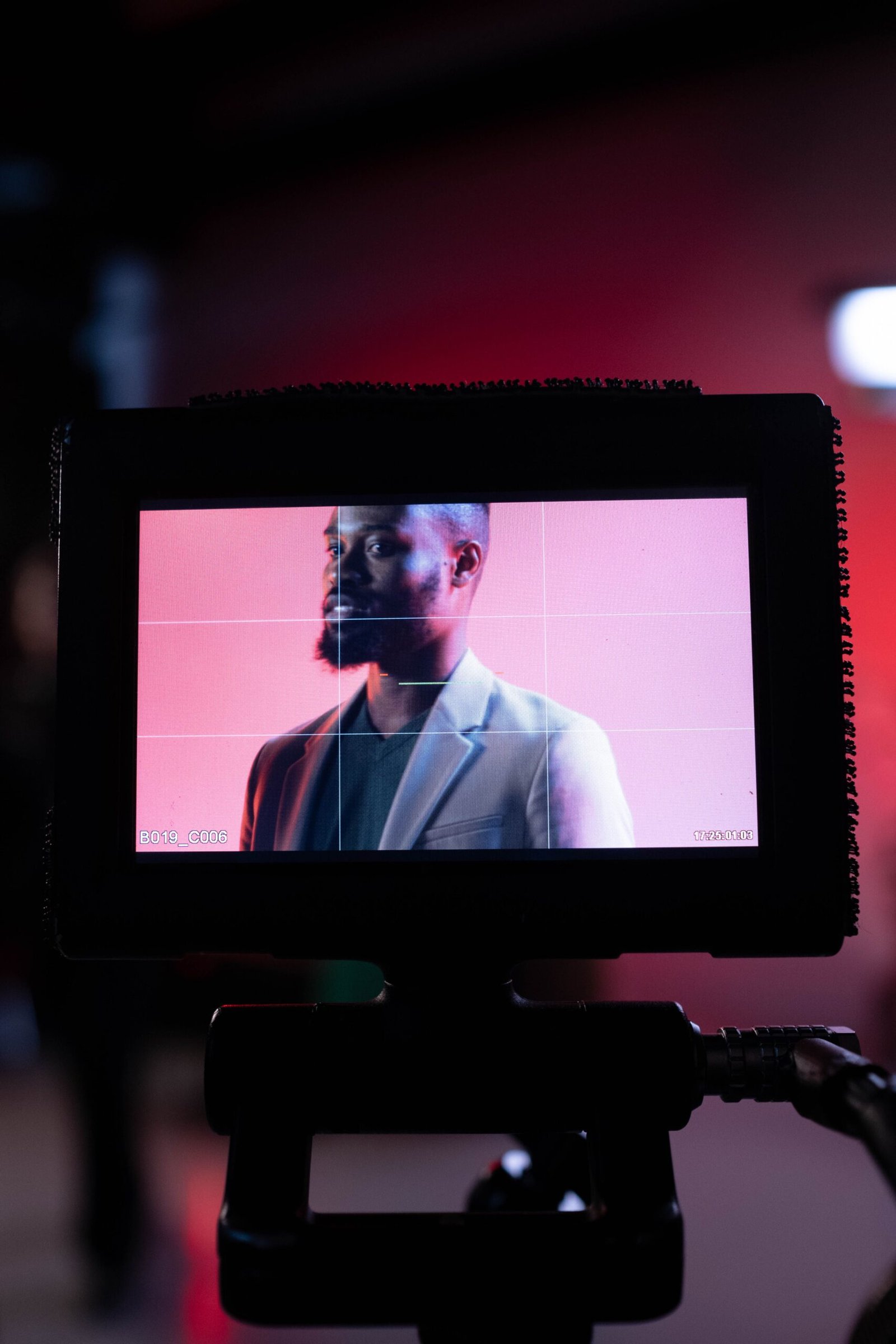 Portrait of a man on a monitor, capturing a behind-the-scenes film production moment.